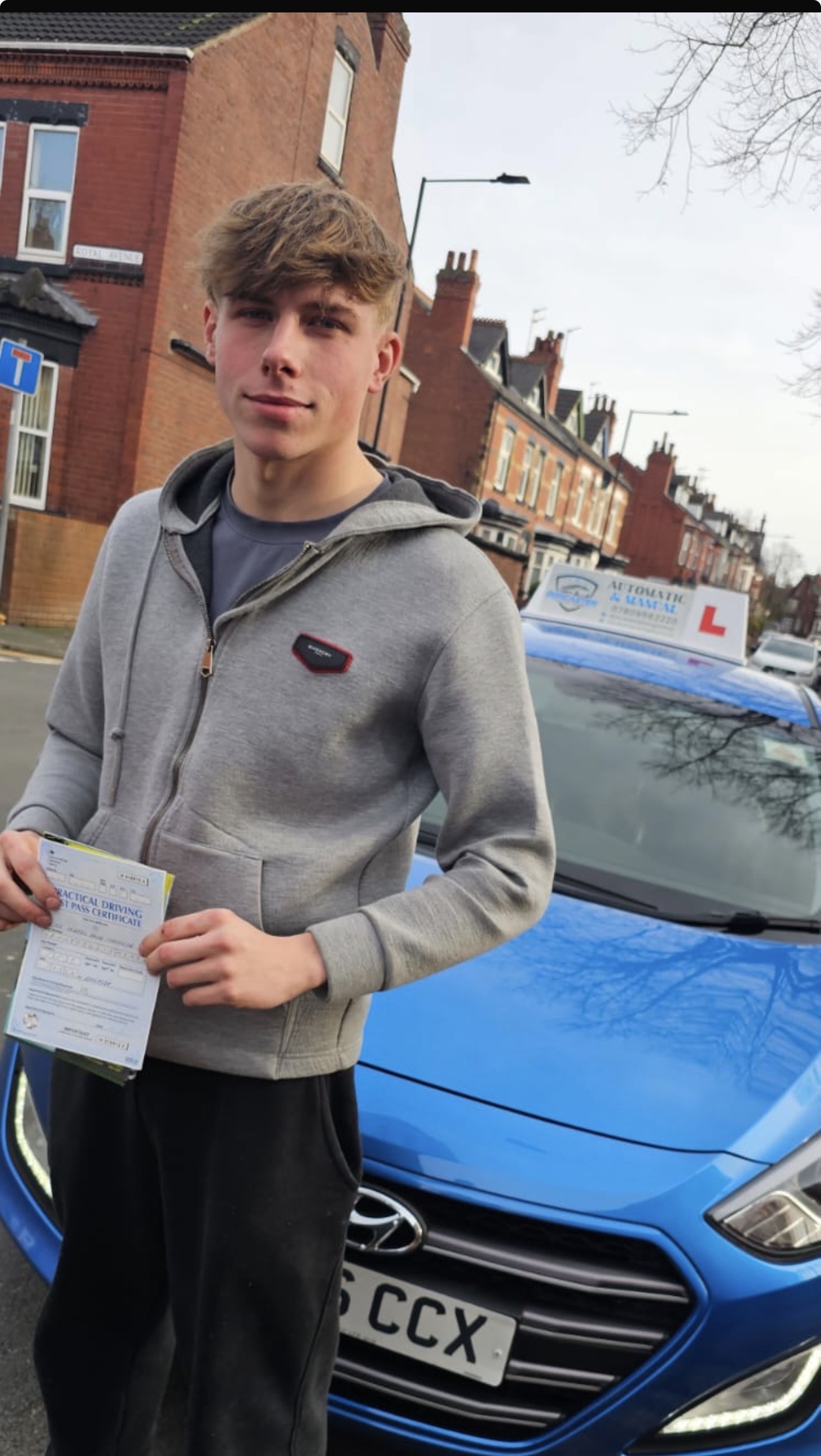 New driver holding a driving licence after passing the test